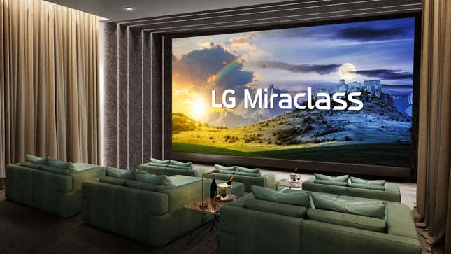An LG Miraclass screen in a smaller theater featuring sofas instead of theater chairs.