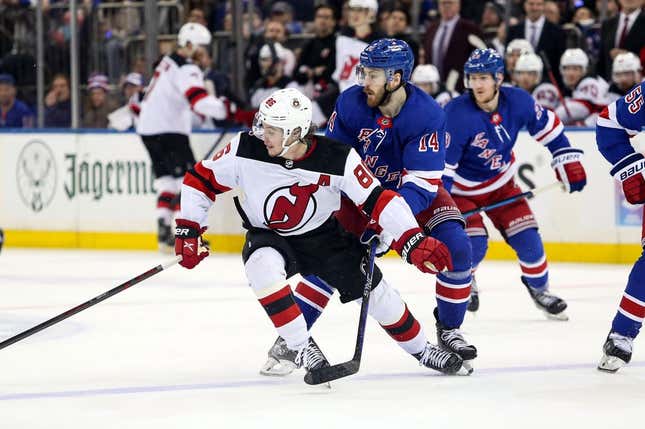 Apr 29, 2023; New York, New York, USA; New Jersey Devils center Jack Hughes (86) and New York Rangers center Tyler Motte (14) chase the puck during the third period in game six of the first round of the 2023 Stanley Cup Playoffs at Madison Square Garden.