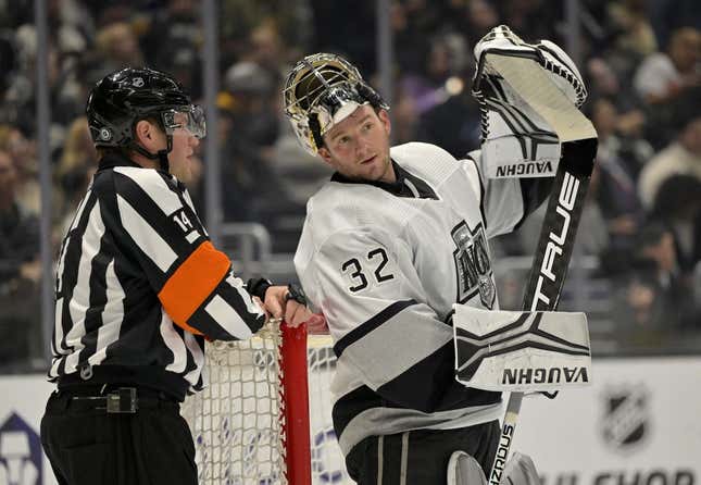 Feb 18, 2023; Los Angeles, California, USA;  Los Angeles Kings goaltender Jonathan Quick (32) talks with referee Trevor Hanson (14) during a stoppage in play against the Arizona Coyotes at Crypto.com Arena.