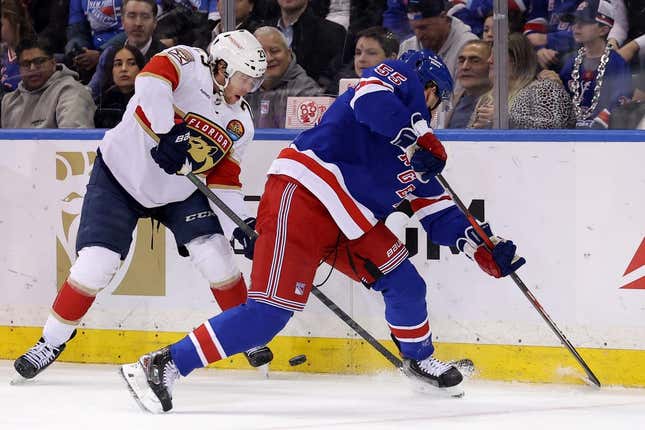 Jan 23, 2023; New York, New York, USA; Florida Panthers center Carter Verhaeghe (23) fights for the puck against New York Rangers defenseman Ryan Lindgren (55) during the second period at Madison Square Garden.