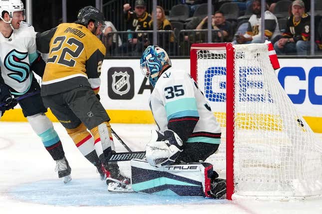 Apr 11, 2023; Las Vegas, Nevada, USA; Vegas Golden Knights right wing Michael Amadio (22) scores against Seattle Kraken goaltender Joey Daccord (35) during the second period at T-Mobile Arena.