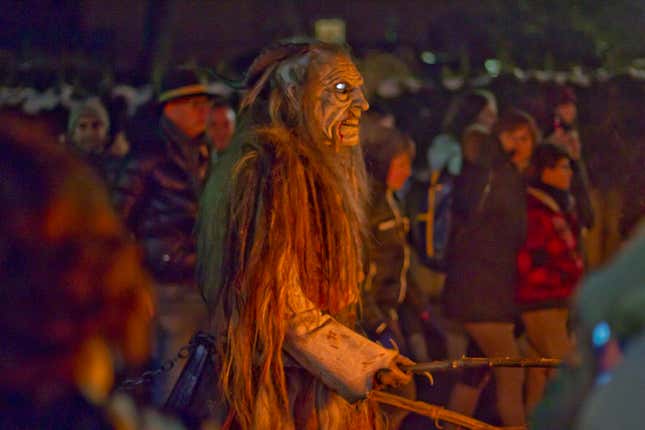 The Krampus carry broken branches as whips for naughty children (and adults).