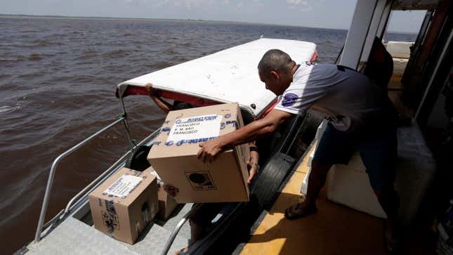 In the Amazon River, electoral workers use boats to move voting machines to voting stations.