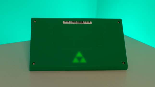 Flip the handheld over and you’ll find a subtle glowing Triforce design on the back.