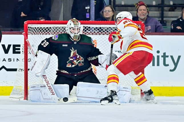 Mar 14, 2023; Tempe, Arizona, USA; Arizona Coyotes goaltender Connor Ingram (39) defends against Calgary Flames center Elias Lindholm (28) in the second period at Mullett Arena.