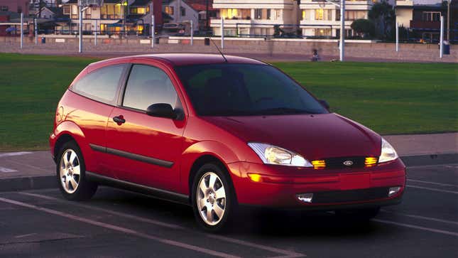 A photo of a red Ford Focus hatchback. 