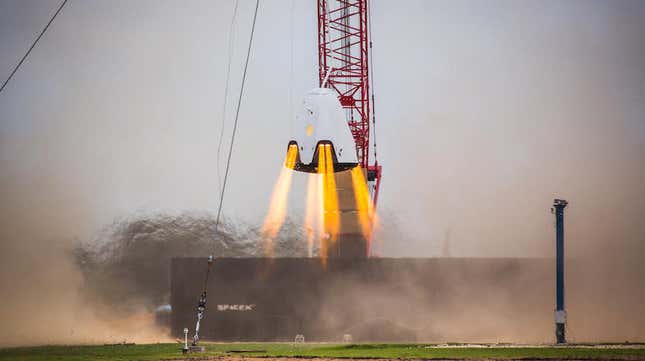 A SpaceX Crew Dragon capsule undergoing a hover test in 2015.