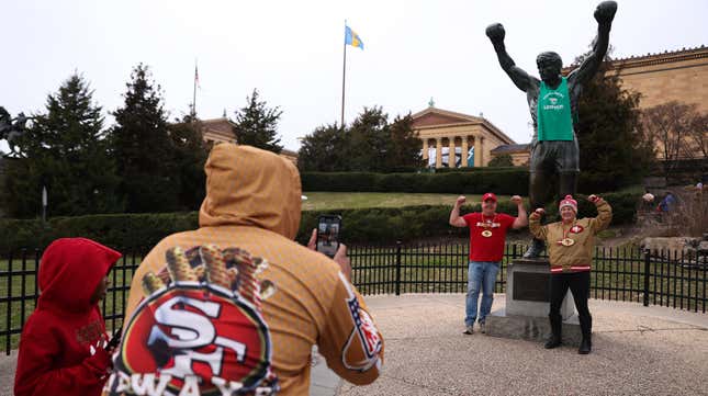 49ers fans pose with the Rocky statue outside the Philadelphia Museum of Art on Jan. 28, 2023, in Philadelphia. 