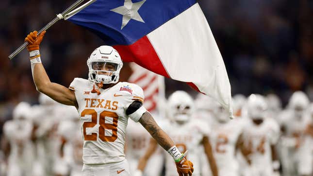 Jerrin Thompson of the Texas Longhorns takes the field during the Valero Alamo Bowl against the Washington Huskies.