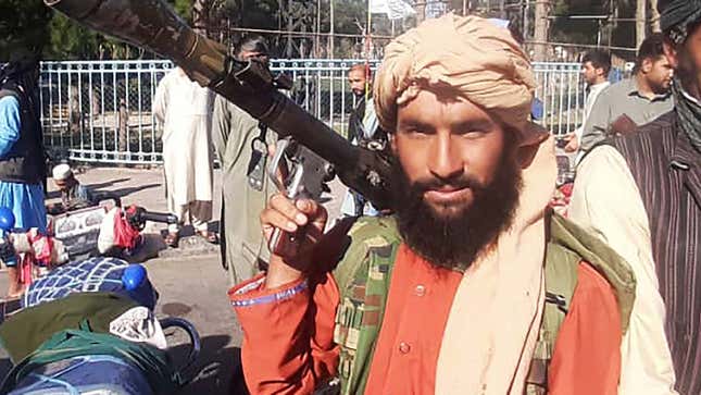 Image for article titled Excited Taliban Fighter Buys Extra Copy Of ‘New York Times’ To Frame