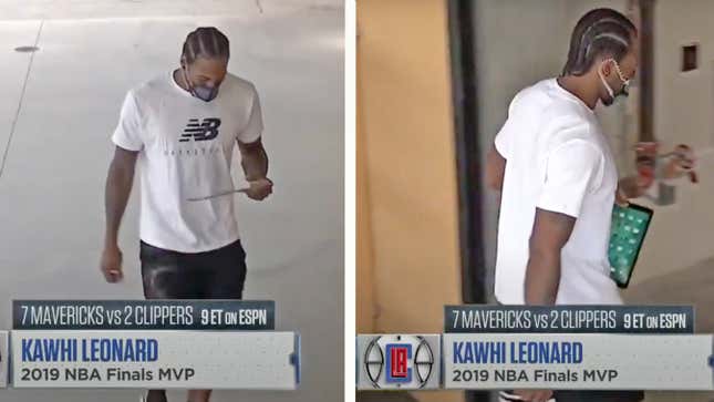 Either something very interesting is happening on Kawhi Leonard’s home screen, or he’s just trying to duck conversation.
