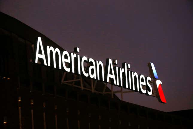 FILE - The American Airlines logo is seen atop the American Airlines Center in Dallas, Texas, Dec. 19, 2017. On Wednesday, Aug. 30, 2023, flight attendants at American Airlines voted overwhelmingly to authorize union leaders to call for a strike, a move intended to put more pressure on the carrier during negotiations over pay raises. (AP Photo/Michael Ainsworth, File)