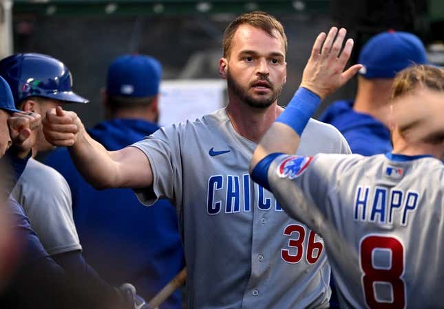 Jun 7, 2023; Anaheim, California, USA;  Chicago Cubs first baseman Trey Mancini (36) is greeted in the dugout after an RBI double and scoring a run in the fifth inning against the Los Angeles Angels at Angel Stadium.