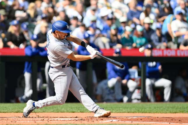 Sep 17, 2023; Seattle, Washington, USA; Los Angeles Dodgers catcher Austin Barnes (15) hits a 2-run home run against the Seattle Mariners during the second inning at T-Mobile Park.