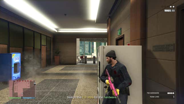 A man in a dark blue shirt takes cover behind a vending machine while police shoot at him.