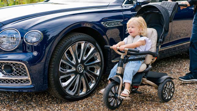 A photo of a child riding the Bentley trike. 