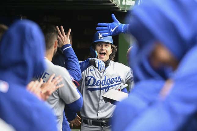 Apr 22, 2023; Chicago, Illinois, USA; Los Angeles Dodgers center fielder James Outman (33) celebrates in the dugout after hitting a home run against the Chicago Cubs during the second inning at Wrigley Field.