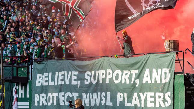 Portland Timbers fans set off red smoke in support of women soccer players during the Major League Soccer playoffs in November 2021.