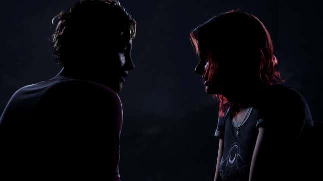Two characters in The Quarry stare at each other, ready to kiss.
