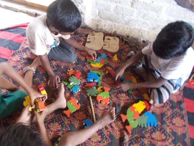 Balwadi kids playing puzzles in Sector 68.