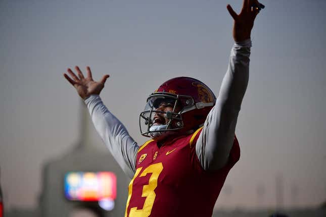 Southern California Trojans quarterback Caleb Williams (13) celebrates Tahj Washington (16) scoring a touchdown against the Notre Dame Fighting Irish during the first half at the Los Angeles Memorial Coliseum.