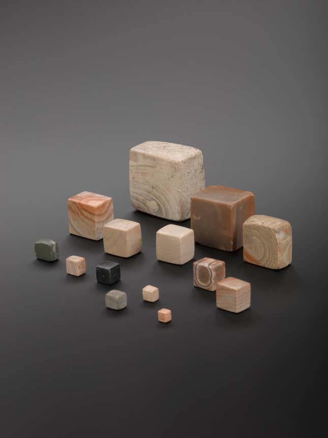 A selection of 14 polished stone (Chert) weights from excavations at Mohenjodaro, Northern India, c.B.C.3000.
