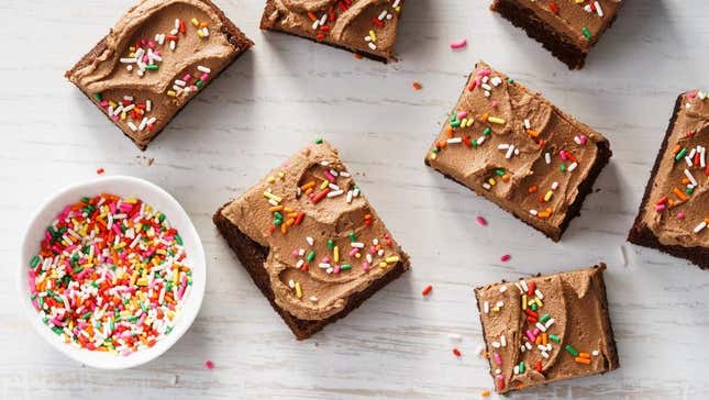Brownies frosted with chocolate topped with sprinkles