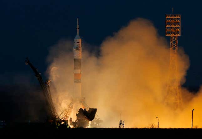 The Soyuz-FG rocket booster with Soyuz TMA-07M space ship transporting U.S. astronaut Thomas Marshburn, Russian cosmonaut Roman Romanenko and Canadian astronaut Chris Hadfield to the International Space Station blasts off from the Russian leased Baikonur cosmodrome, Kazakhstan, Wednesday, Dec. 19, 2012. (AP Photo/Dmitry Lovetsky)