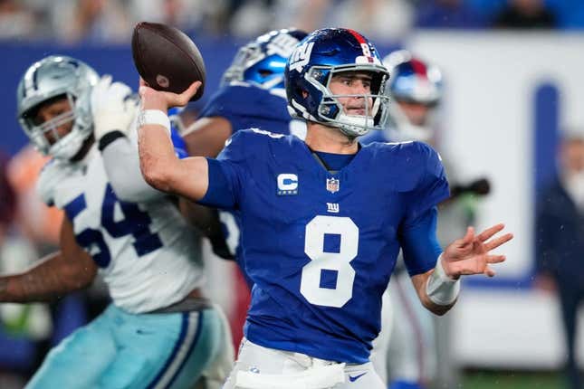 New York Giants quarterback Daniel Jones (8) throws a pass as he receives help from his offensive line. Sunday, September 10, 2023