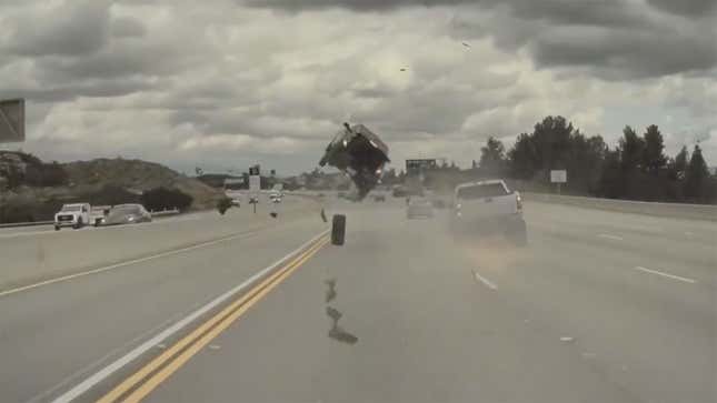 A screenshot of a Kia car crashing on a highway. 