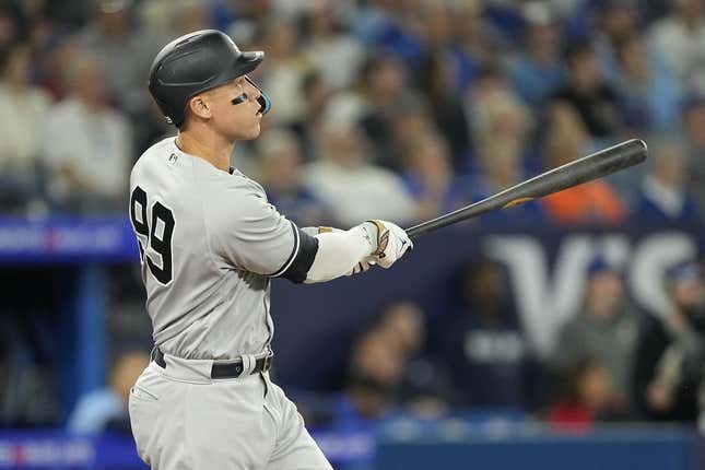 May 16, 2023; Toronto, Ontario, CAN; New York Yankees designated hitter Aaron Judge (99) watches his ball go over the center field wall for a two run home run against the Toronto Blue Jays during the eighth inning at Rogers Centre.