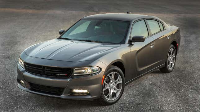 A photo of a silver Dodge Charger SXT muscle car.