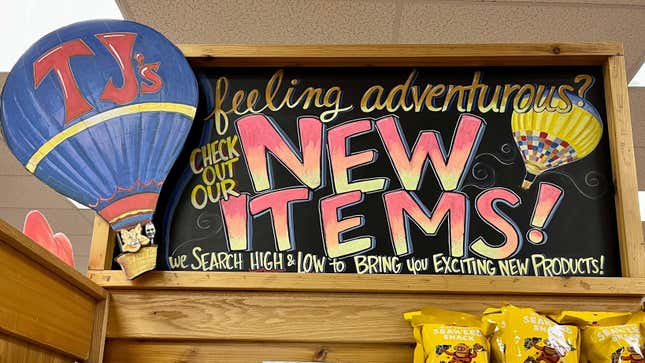 Trader Joe's sign that reads, "Check out our new items!"