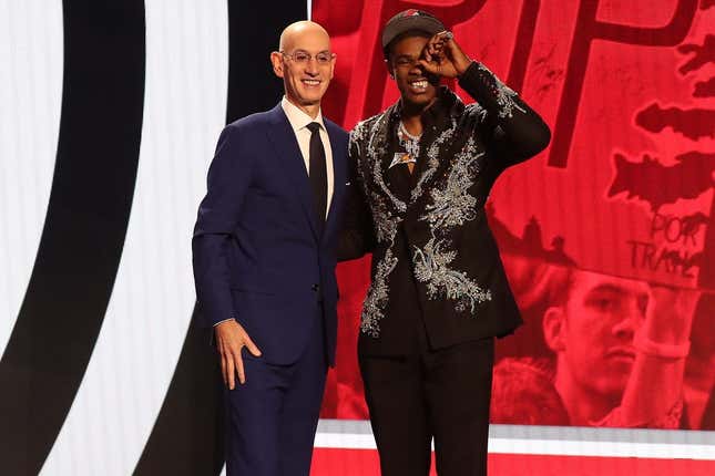 Jun 22, 2023; Brooklyn, NY, USA; Scoot Henderson with NBA commissioner Adam Silver after being selected third by the Portland Trail Blazers in the first round of the 2023 NBA Draft at Barclays Arena.