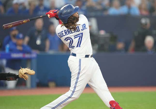 Jun 29, 2023; Toronto, Ontario, CAN; Toronto Blue Jays designated hitter Vladimir Guerrero Jr. (27) hits a two run home run against the San Francisco Giants during the sixth inning at Rogers Centre.