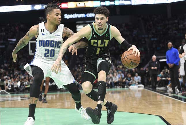 Feb 5, 2023; Charlotte, North Carolina, USA; Charlotte Hornets guard LaMelo Ball (1) drives past Orlando Magic guard Markelle Fultz (20) during the second half at the Spectrum Center.