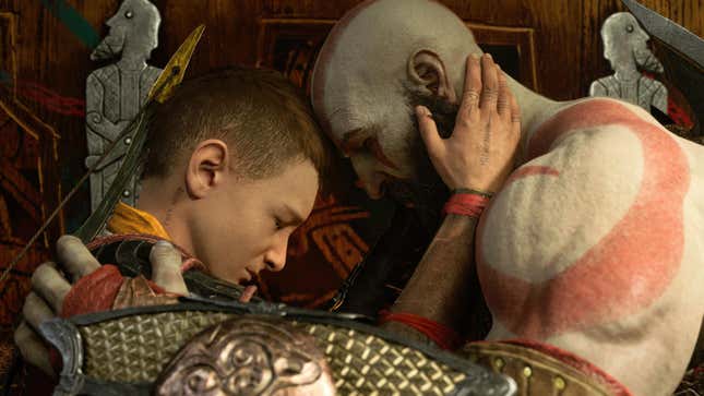Kratos and Atreus are seen embracing each other in front of a giant prophecy.