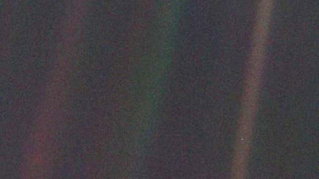 An image of a dark sky with a tiny blue dot in the right corner, this is Earth. 