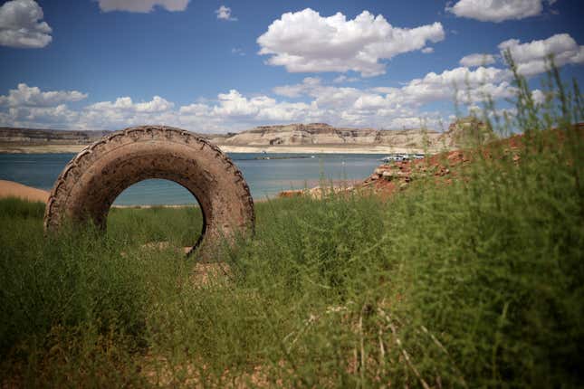 A tire sits on dry land in a section of Lake Powell that used to be underwater on June 24, 2021 in Lake Powell, Utah.