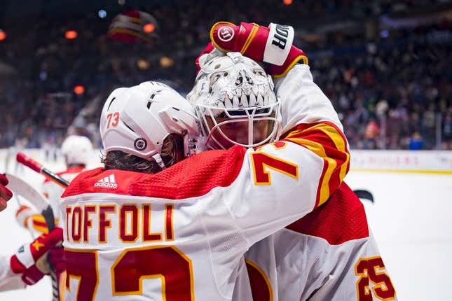 Mar 31, 2023; Vancouver, British Columbia, CAN; Calgary Flames forward Tyler Toffoli (73) and goalie Jacob Markstrom (25) celebrate Toffoli   s game winning overtime goal against the Vancouver Canucks at Rogers Arena. Calgary won 5-4 on overtime.