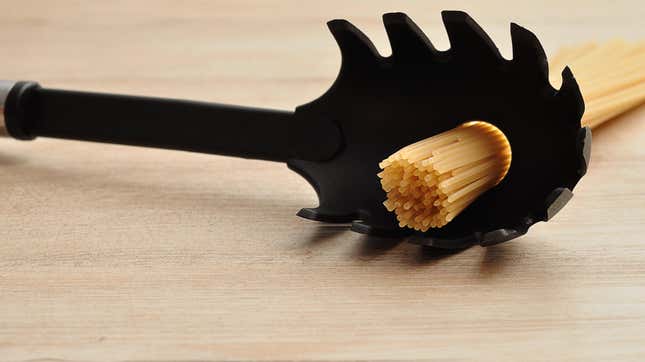 Pasta spoon with pasta through hole