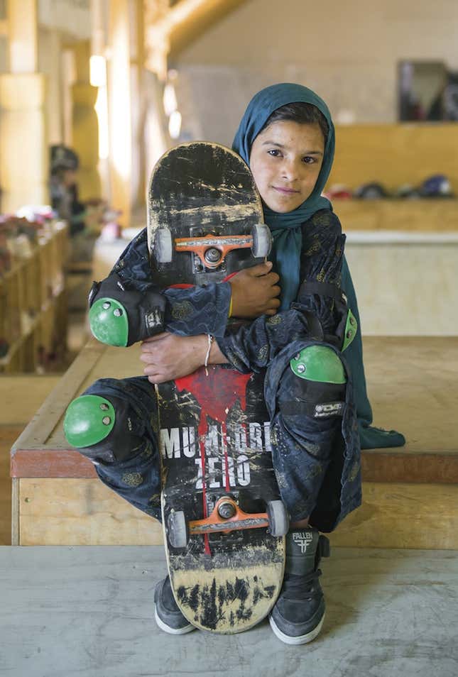 Image for article titled Photos: Forbidden from riding bikes, fearless Afghan girls are skateboarding around Kabul