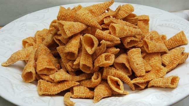 Pile of Bugles snack chips on a white plate