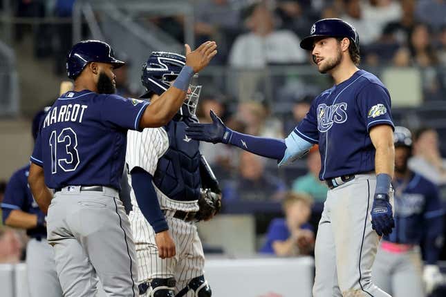 May 11, 2023; Bronx, New York, USA; Tampa Bay Rays right fielder Josh Lowe (15) celebrates his two run home run against the New York Yankees with center fielder Manuel Margot (13) during the eighth inning at Yankee Stadium.