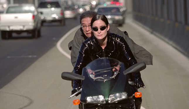 Trinity and the key maker on a ducati motorcycle