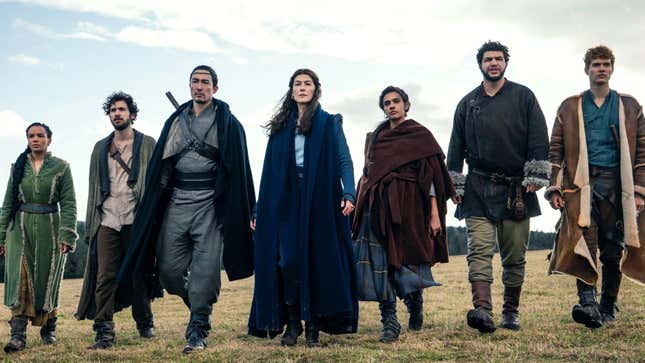 Seven castmembers of Amazon's The Wheel of Time adaptation stand side by side in a row.