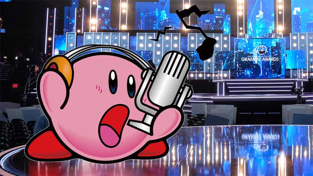 Kirby sings into a microphone while standing on the stage of the Grammys.