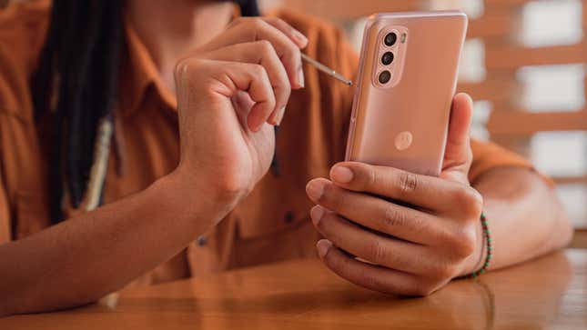 A photo of a person using the Moto G Stylus 