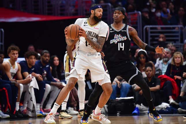 Mar 25, 2023; Los Angeles, California, USA; New Orleans Pelicans forward Brandon Ingram (14) controls the ball against Los Angeles Clippers guard Terance Mann (14) during the second half at Crypto.com Arena.
