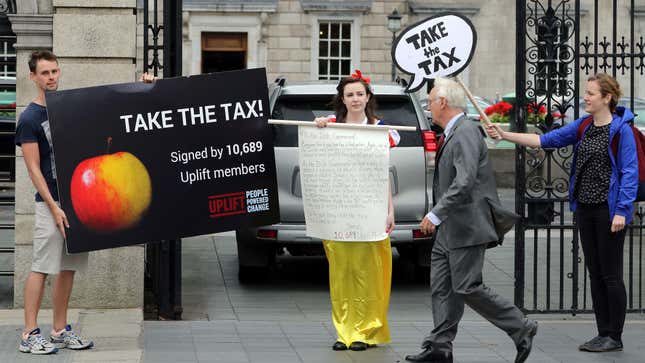 Protesters against Apple’s tax avoidance strategies outside the Parliament of Ireland in Dublin on September 2, 2016.